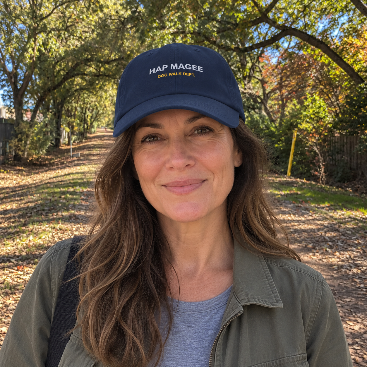 Hap Magee Dog Walk cap worn by a woman on the Iron Horse Trail — digital product visualization
