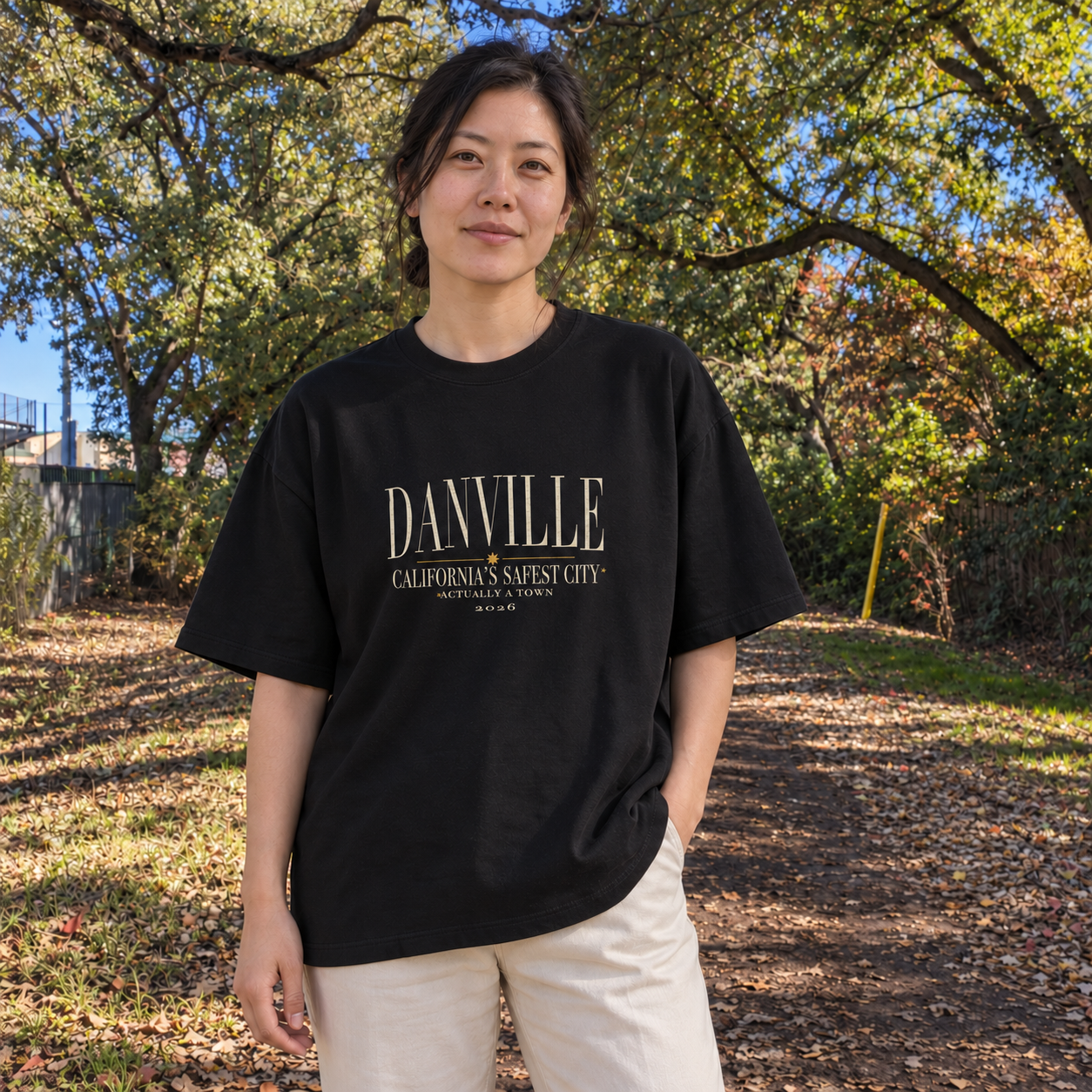 Safest city, actually a town Oversized tee in Black, Iron Horse Trail model scene 2 — digital product visualization