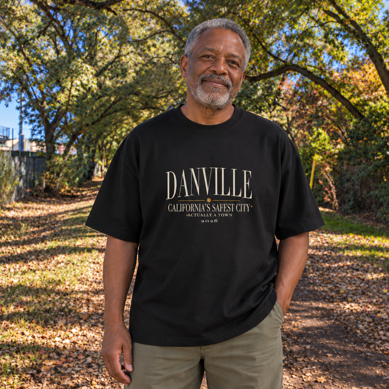 Safest city, actually a town Oversized tee in Black, Iron Horse Trail model scene 3 — digital product visualization