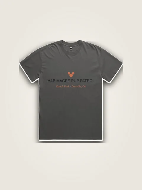 Studio product flat lay of Little Dogs of Hap Magee Toddler Tee on authentic supplier blank